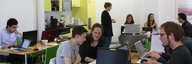 Students work together on their Wikipedia contributions in the cafeteria of the PTT archive. - enlarged view