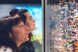 Deux personnes regardent une vitrine remplie d'une multitude de petites figurines.