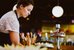 A woman prepares a buffet with small delicacies. - enlarged view