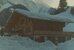 Älteres Foto eines Chalets im hohen Schnee - die Poststelle Im Fang. - vergrösserte Ansicht