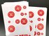 Mehrere Klebebogen, darauf rote Sticker "Die Dinge gendern sich" auf weissem Grund.